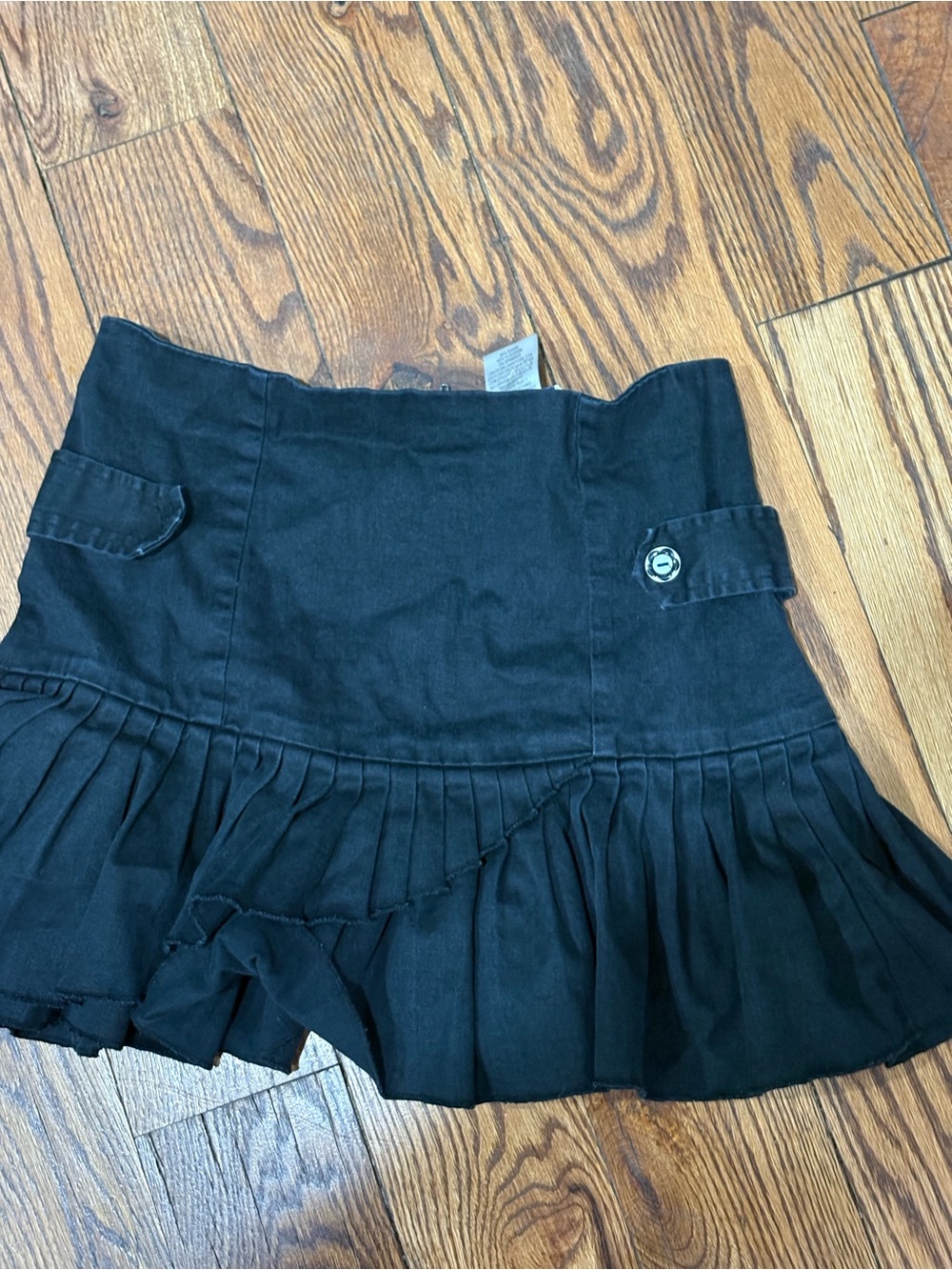 Girls Black Ruffle Pleated Skirt with Decorative Tab